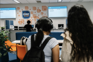 Students gather in the One-Stop Financial Office after UMass Boston guaranteed free tuition for eligible students through the Beacon Pledge.